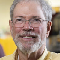 Environmental portrait of professor Christopher West in a Davison Life Sciences Building laboratory.